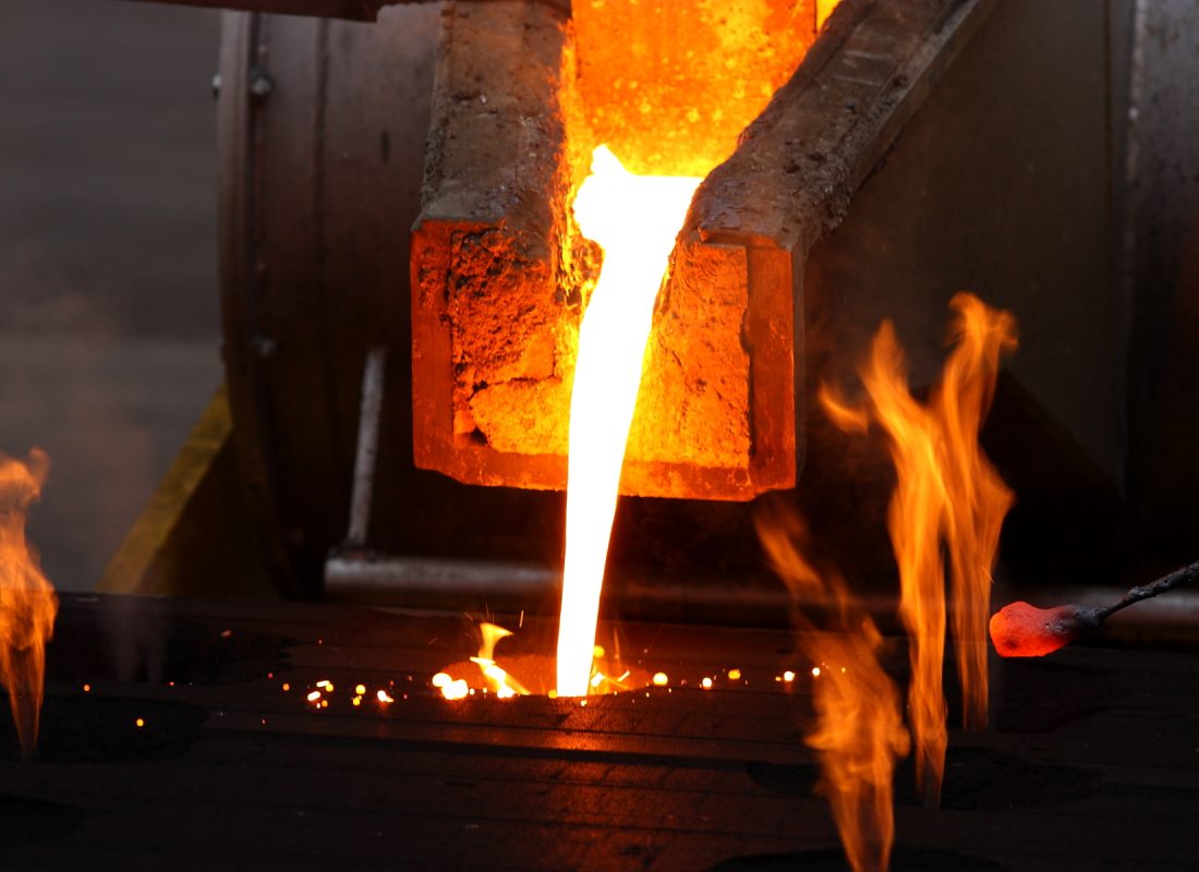 Molten metal poured from lathe for iron casting.
